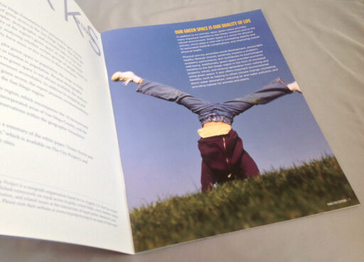 A brochure with an image of a person standing on one arm.