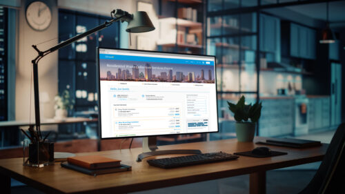 Office desk showing image of a website for the San Diego Waste Collection