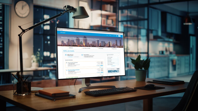 Office desk showing image of a website for the San Diego Waste Collection